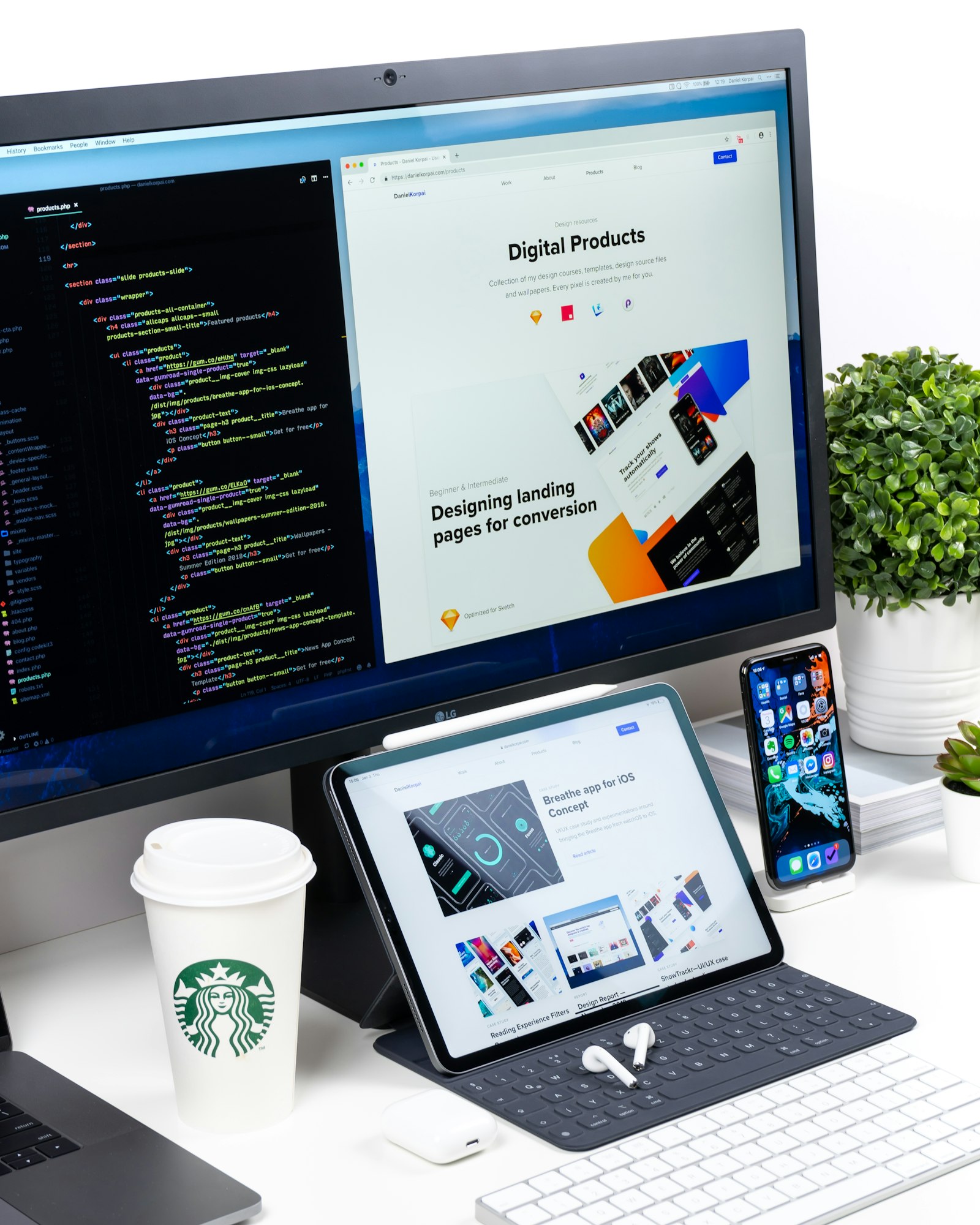 Two web developers building a responsive website on dual monitors